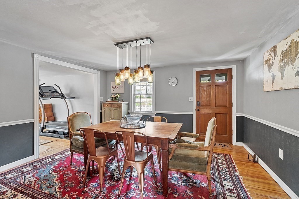 131 Lawrence Road Haverhill, MA 01835 - Photo 20 of 39 a view of a dining room with furniture and chandelier