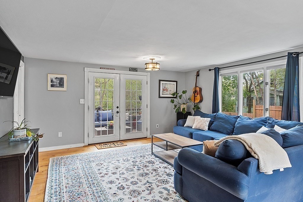 131 Lawrence Road Haverhill, MA 01835 - Photo 25 of 39 a living room with furniture and a flat screen tv