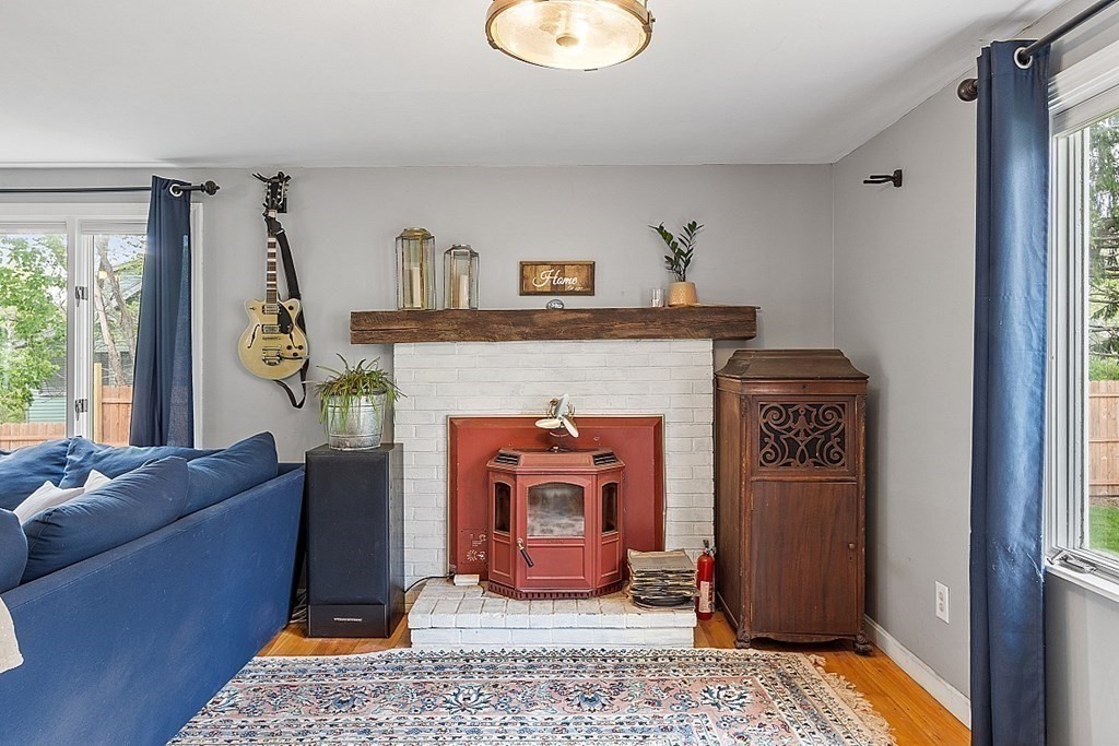131 Lawrence Road Haverhill, MA 01835 - Photo 26 of 39 a living room with furniture and a fireplace