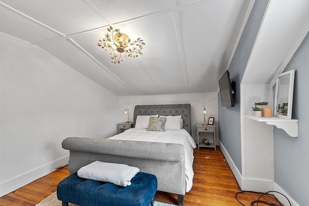 131 Lawrence Road Haverhill, MA 01835 - Photo 28 of 39 a bedroom with furniture and a chandelier