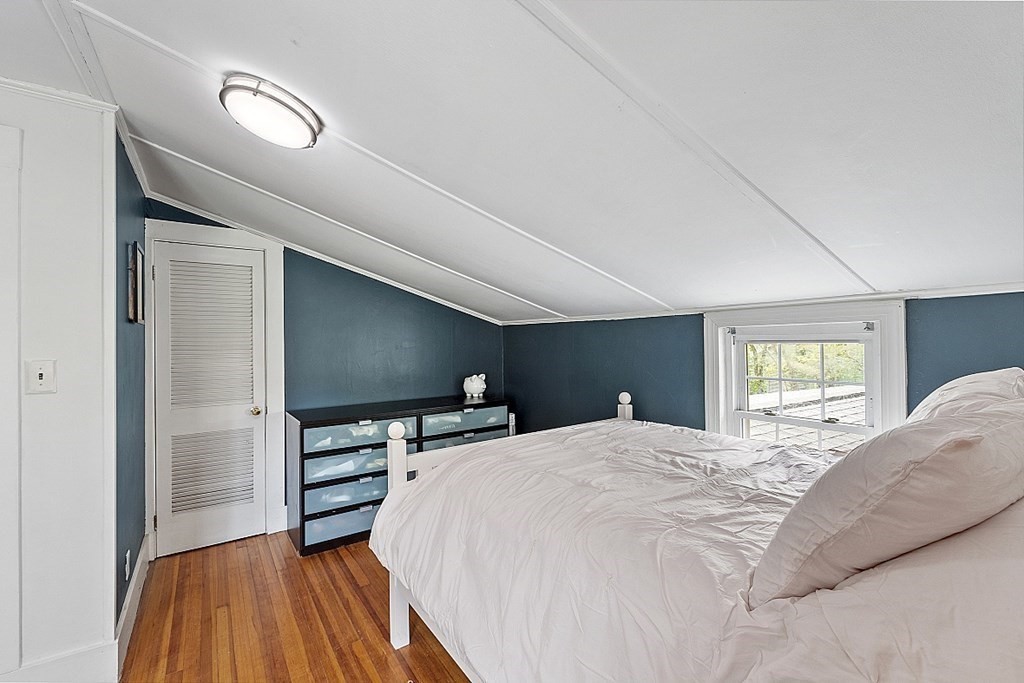 131 Lawrence Road Haverhill, MA 01835 - Photo 33 of 39 a bedroom with a bed and a flat screen tv