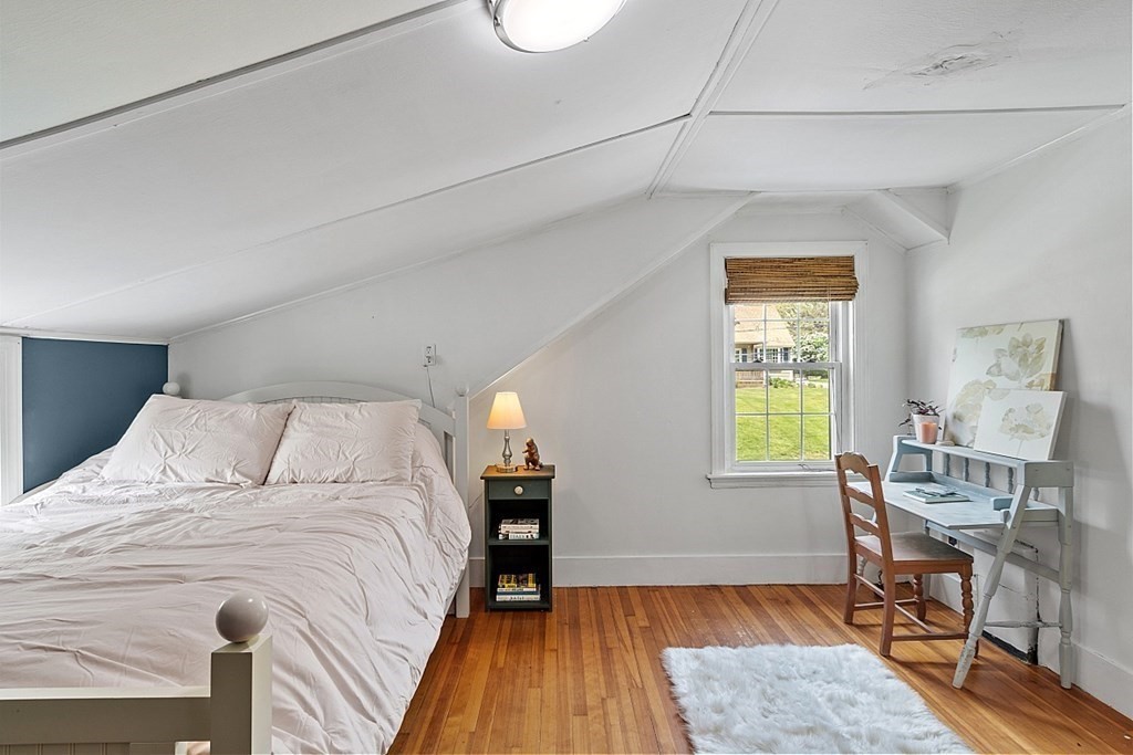 131 Lawrence Road Haverhill, MA 01835 - Photo 34 of 39 a bedroom with a bed and a table in it