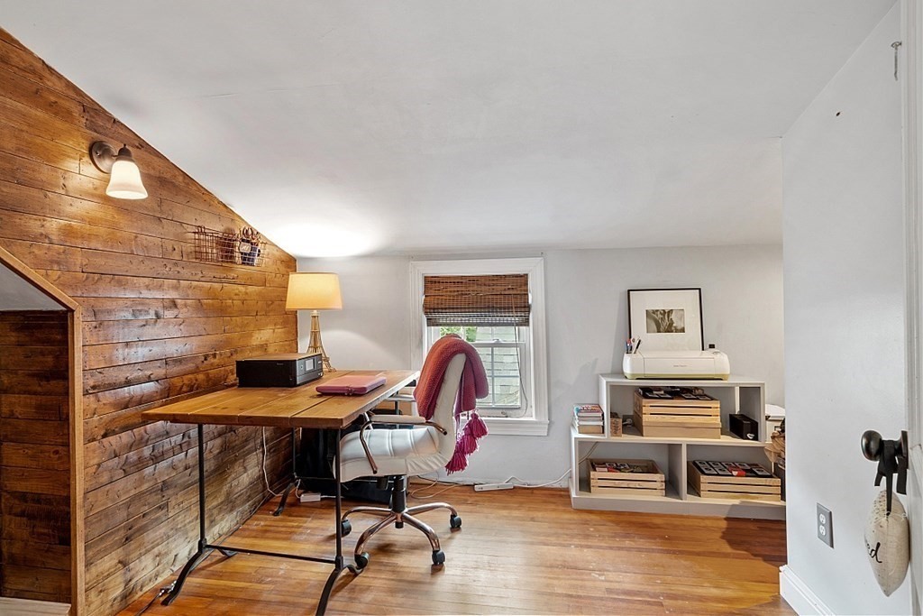 131 Lawrence Road Haverhill, MA 01835 - Photo 36 of 39 a workspace with furniture and wooden floor