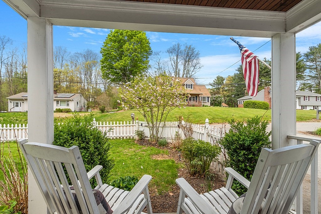 131 Lawrence Road Haverhill, MA 01835 - Photo 6 of 39 a view of a porch with chairs and backyard