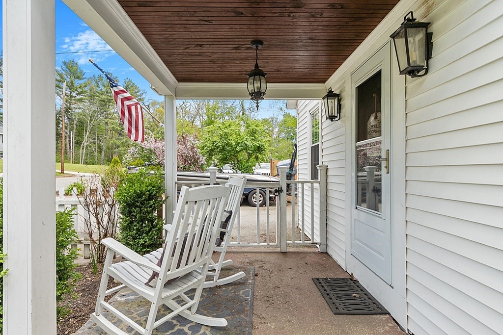 131 Lawrence Road Haverhill, MA 01835 - Photo 7 of 39 a porch with a table and chairs