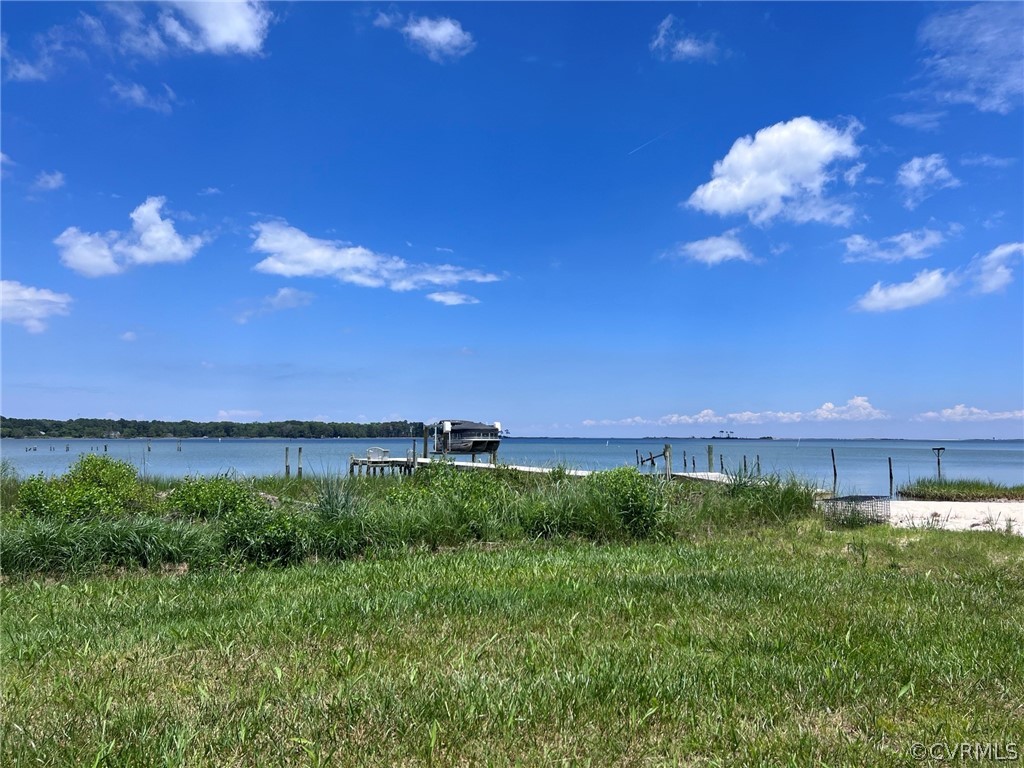 View of water feature with a boat dock