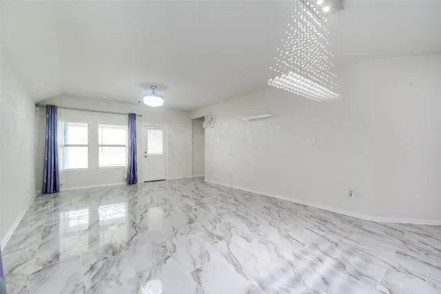 a view of an empty room and window