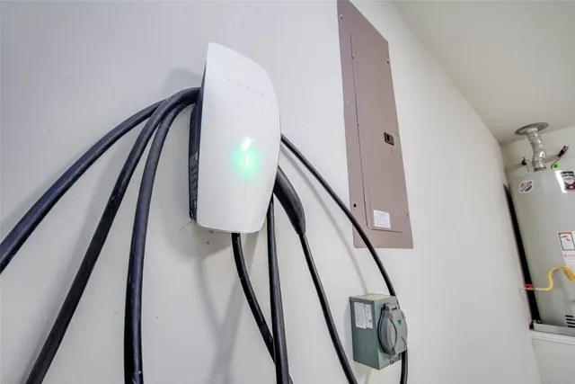 a view of staircase with railing and white walls