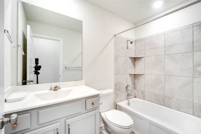 a bathroom with a sink a toilet and bathtub