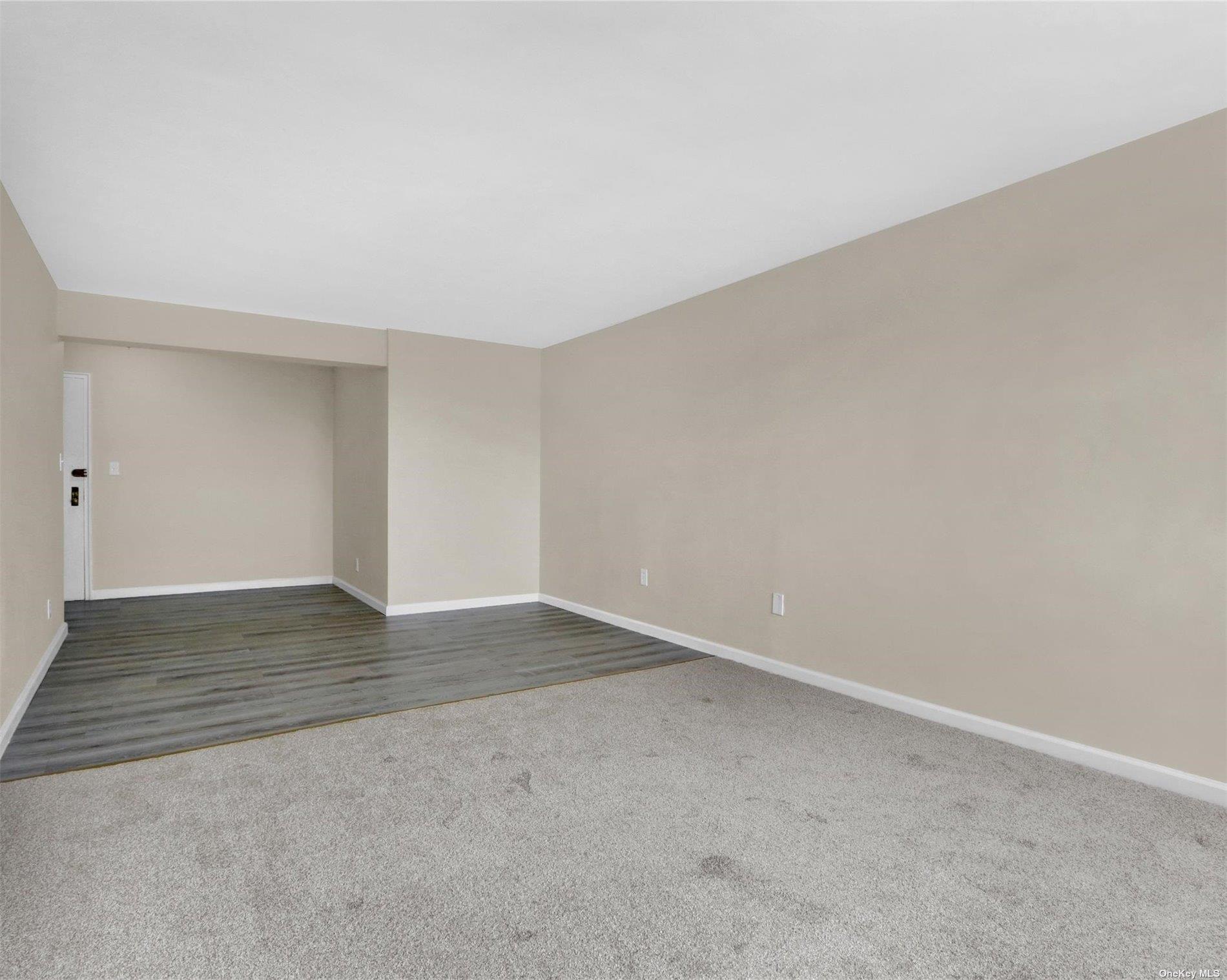 151-31 88th Street, Unit 6H Queens, NY 11414 - Photo 10 of 20 a view of an empty room and wooden floor