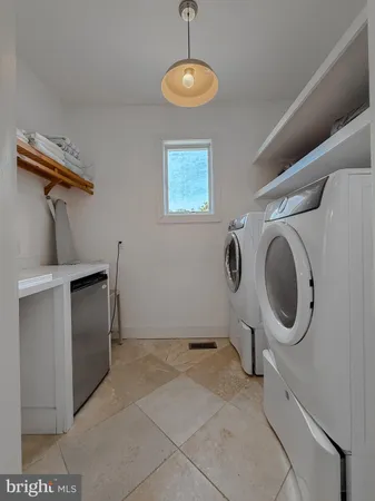 a kitchen with stainless steel appliances kitchen island granite countertop a sink and cabinets