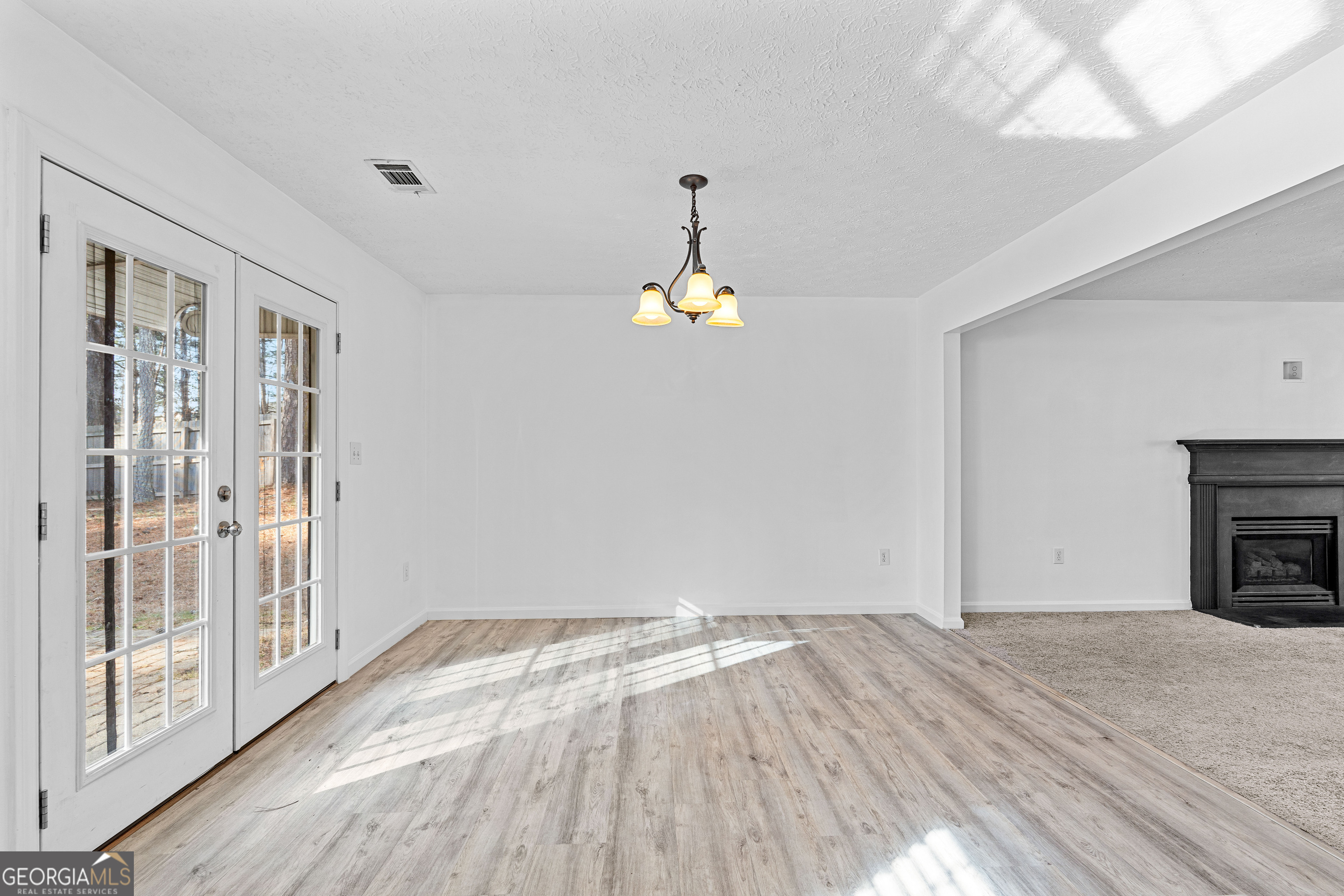 19 Rayner Drive Newnan, GA 30265 - Photo 11 of 53 a view of empty room with wooden floor and fan