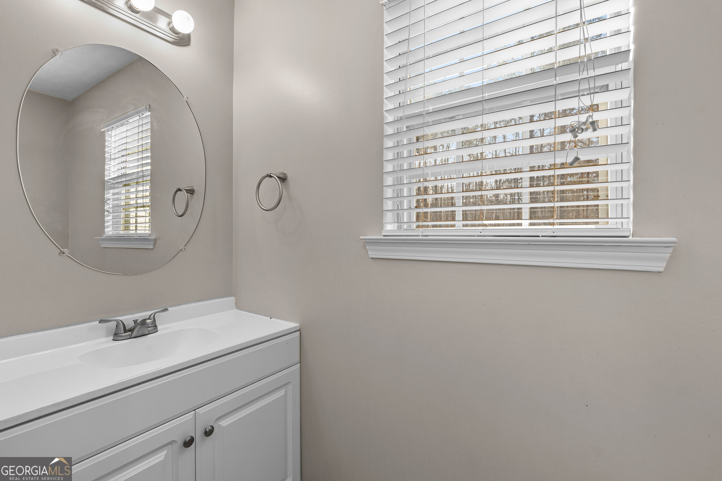 19 Rayner Drive Newnan, GA 30265 - Photo 16 of 53 a bathroom with a sink and a mirror