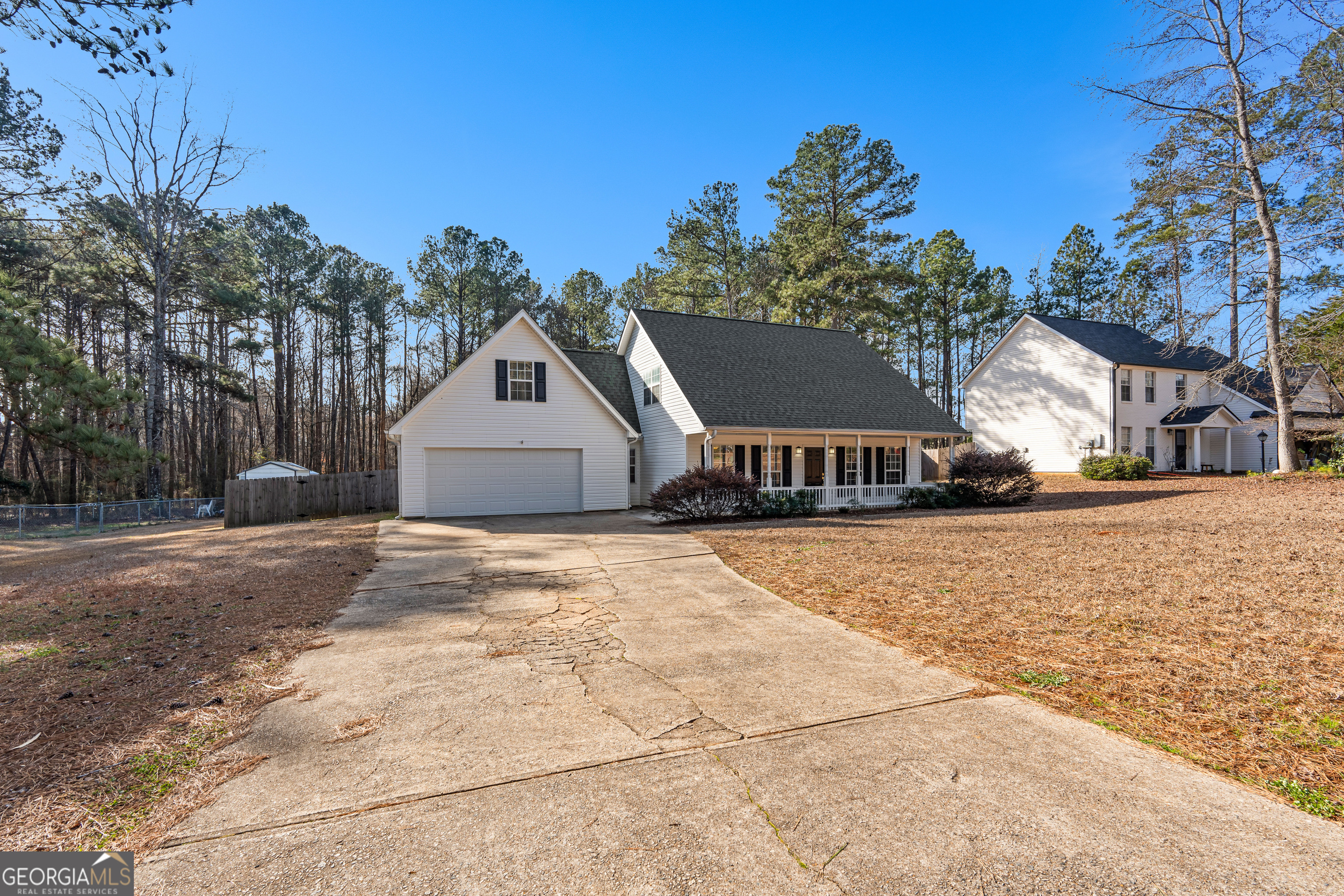 19 Rayner Drive Newnan, GA 30265 - Photo 2 of 53 a front view of a house with a yard and garage