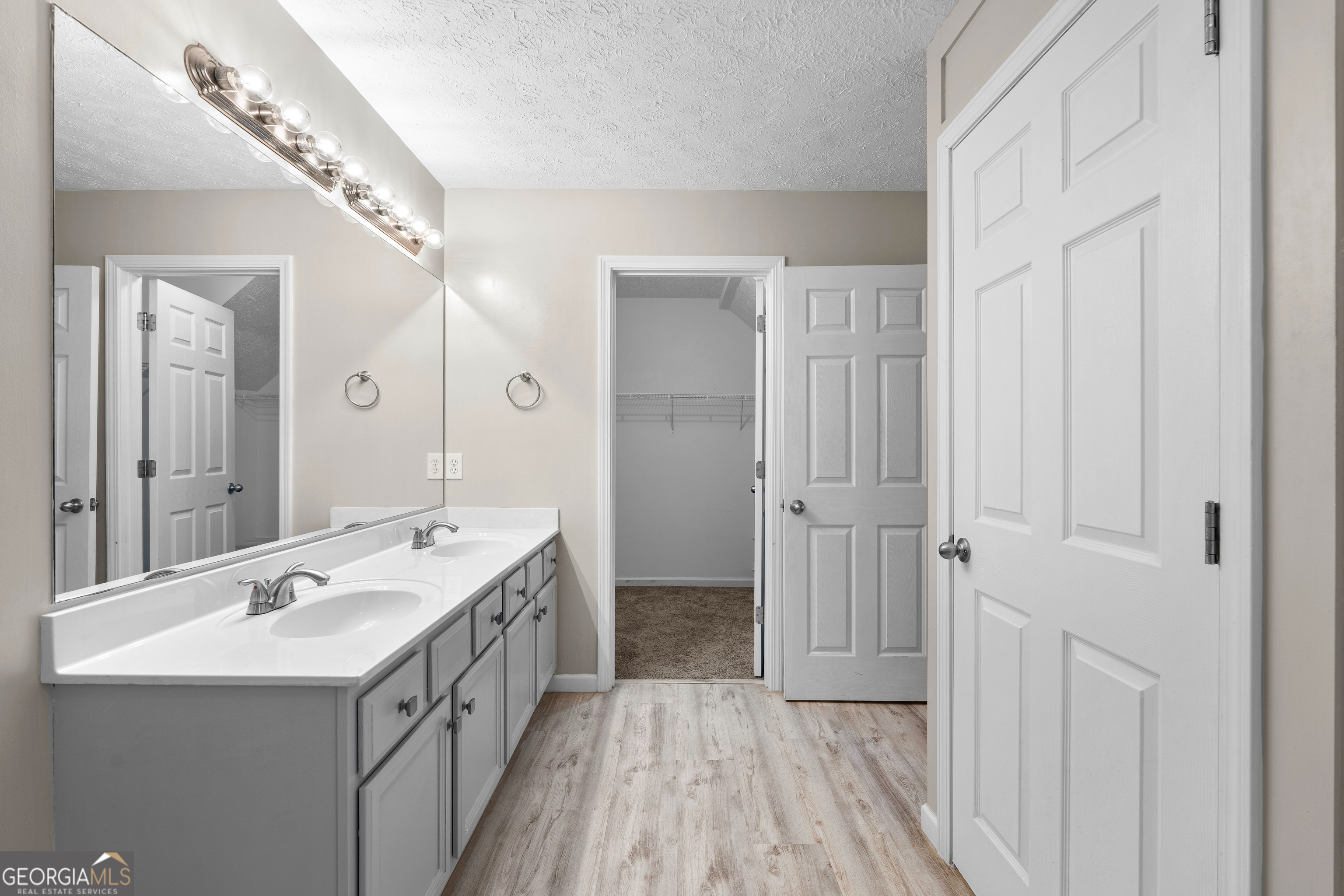 19 Rayner Drive Newnan, GA 30265 - Photo 22 of 53 a bathroom with a double vanity sink and mirror