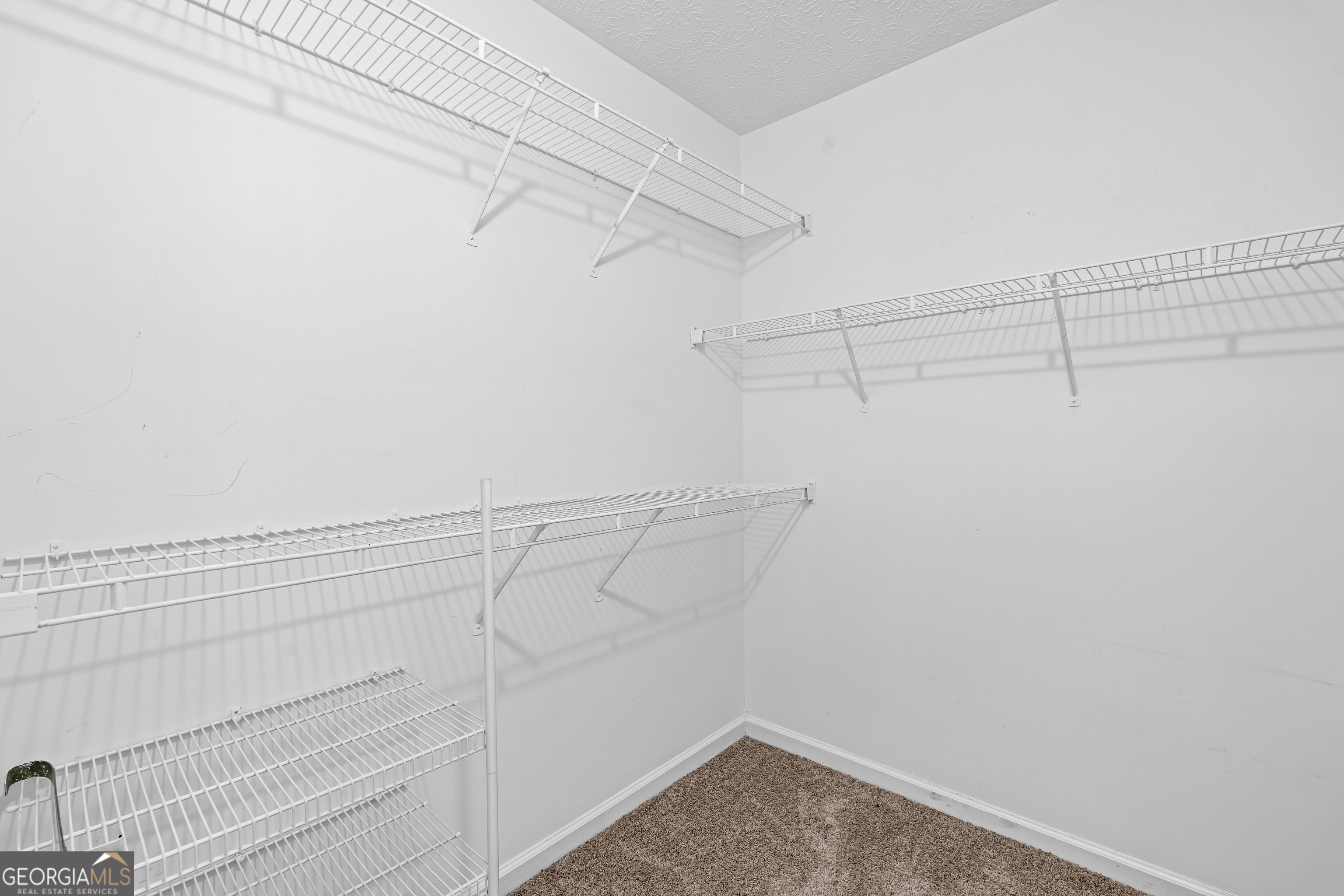 19 Rayner Drive Newnan, GA 30265 - Photo 23 of 53 a view of a room with racks on the wall
