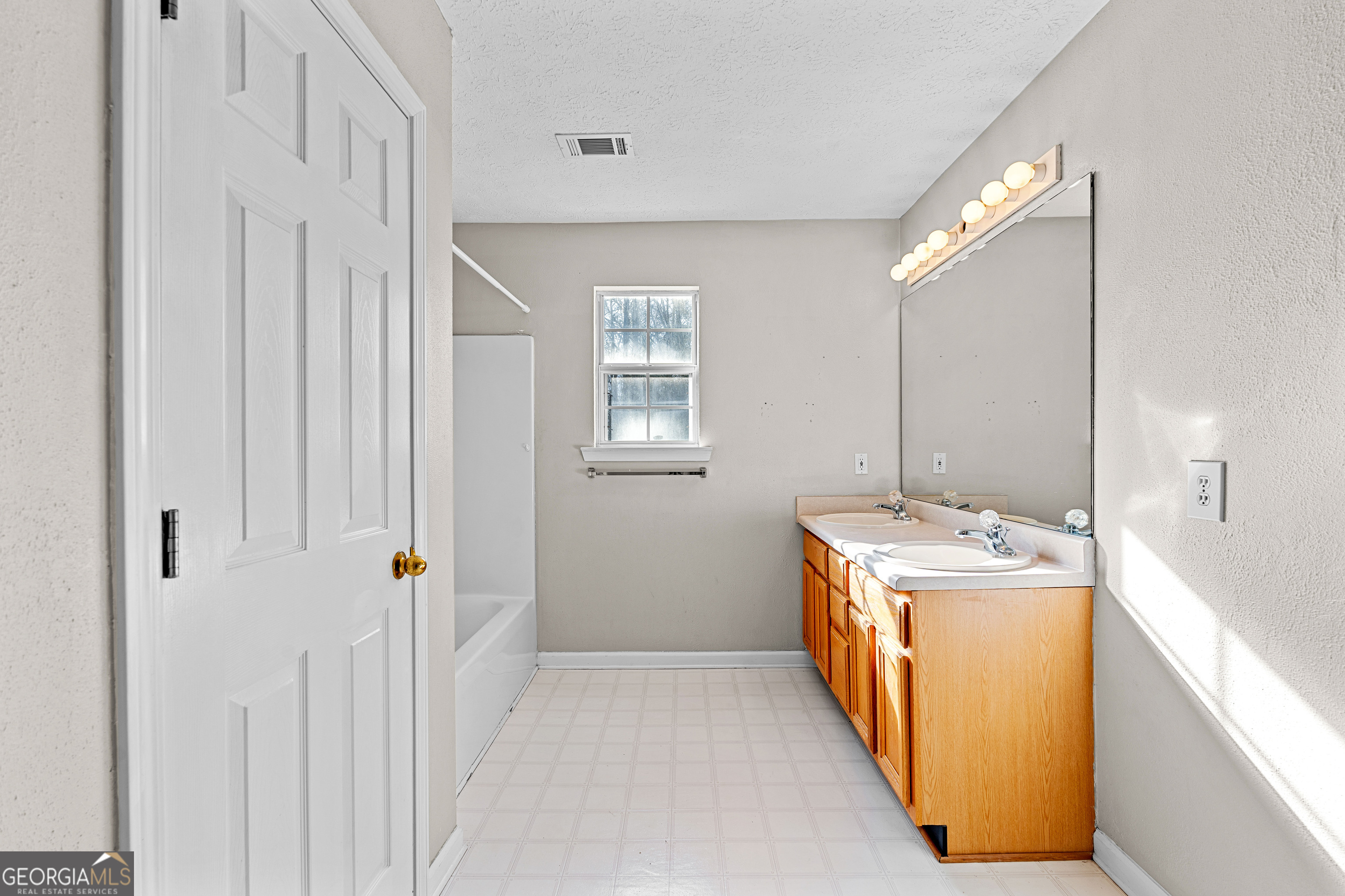 19 Rayner Drive Newnan, GA 30265 - Photo 33 of 53 a room with a sink and a washer dryer