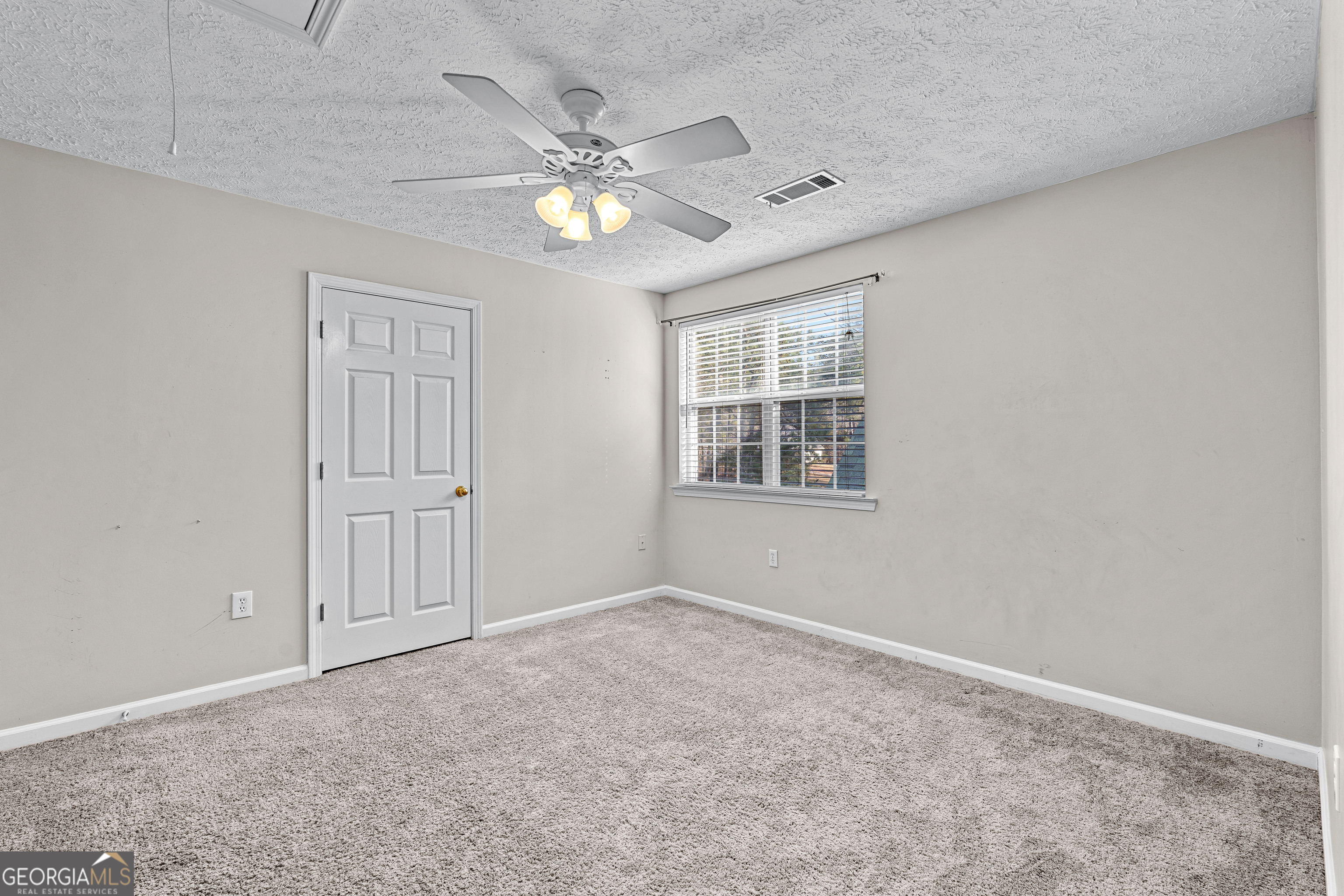 19 Rayner Drive Newnan, GA 30265 - Photo 35 of 53 a view of an empty room with a window