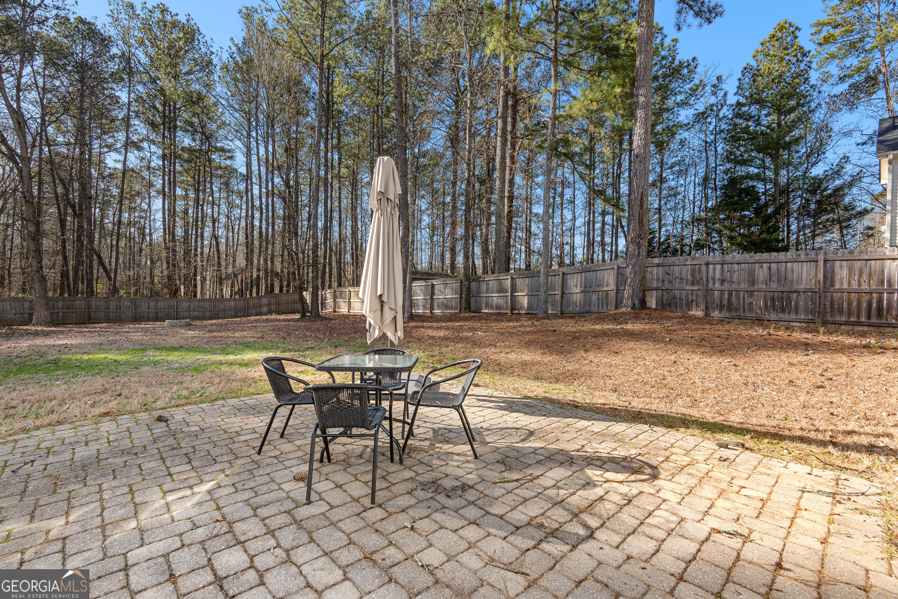 19 Rayner Drive Newnan, GA 30265 - Photo 43 of 53 a view of a backyard with a table and chairs