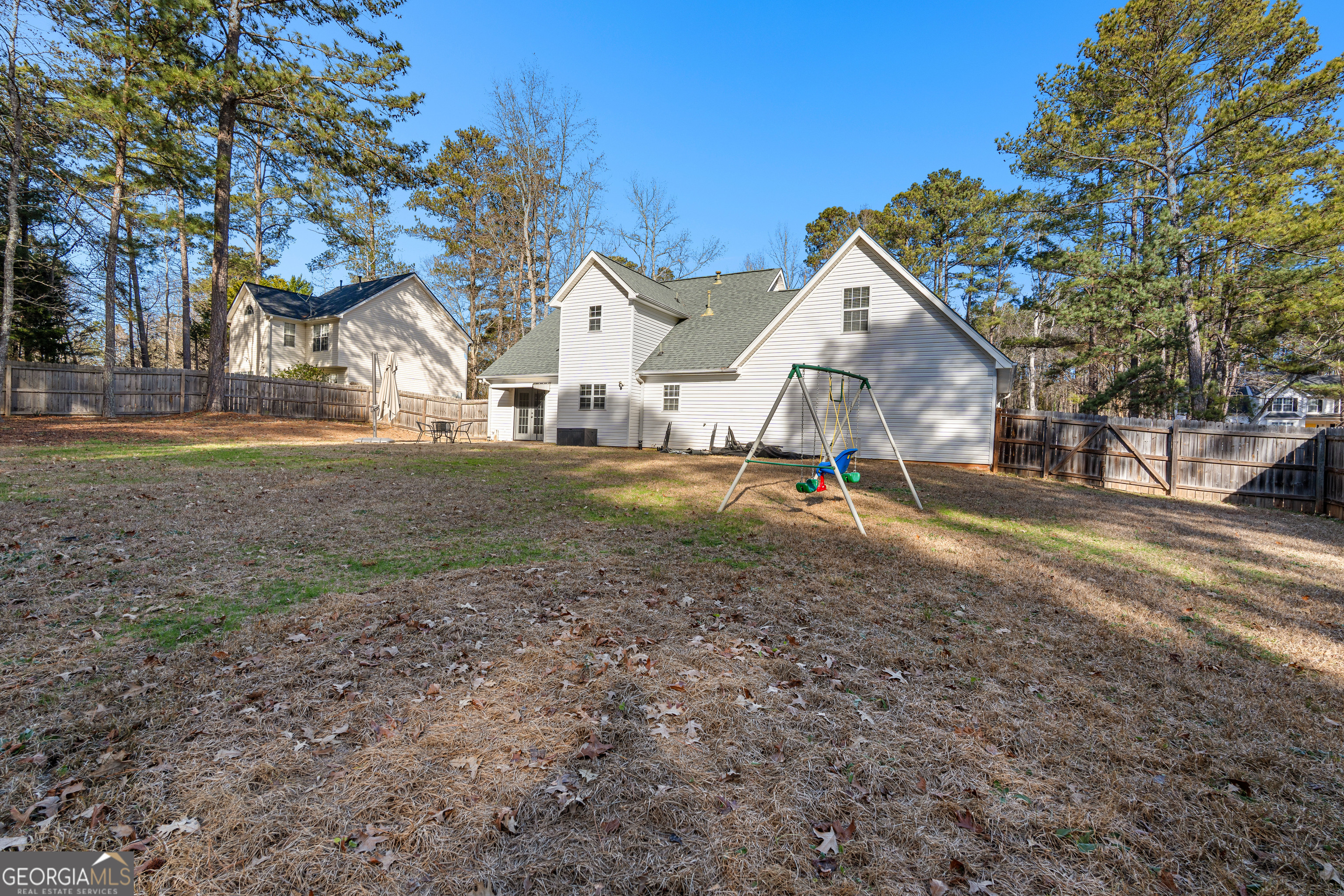 19 Rayner Drive Newnan, GA 30265 - Photo 48 of 53 a view of a large house with a yard and large trees