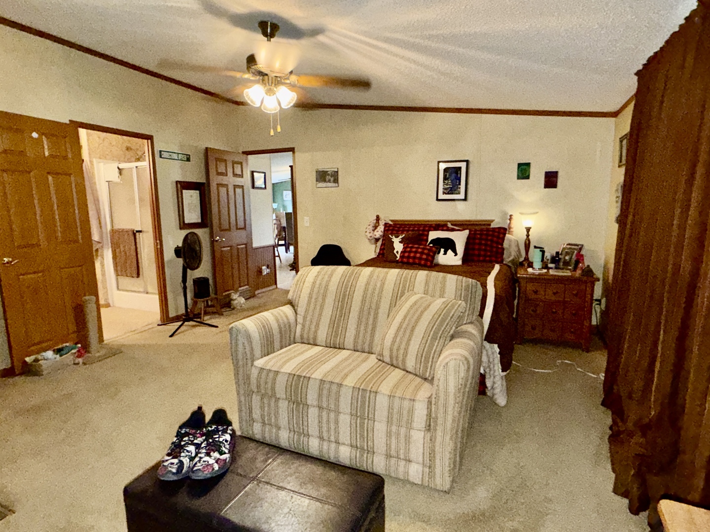 2025 Central Hill Road Grantsburg, IL 62943 - Photo 13 of 31 a bedroom with a bed and a chandelier