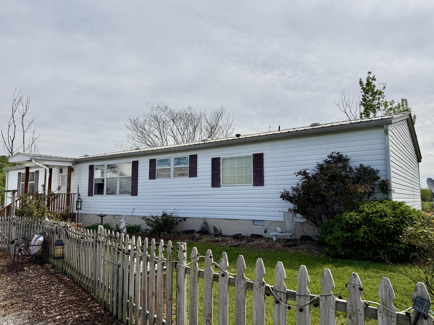 2025 Central Hill Road Grantsburg, IL 62943 - Photo 2 of 31 a front view of a house with a garden