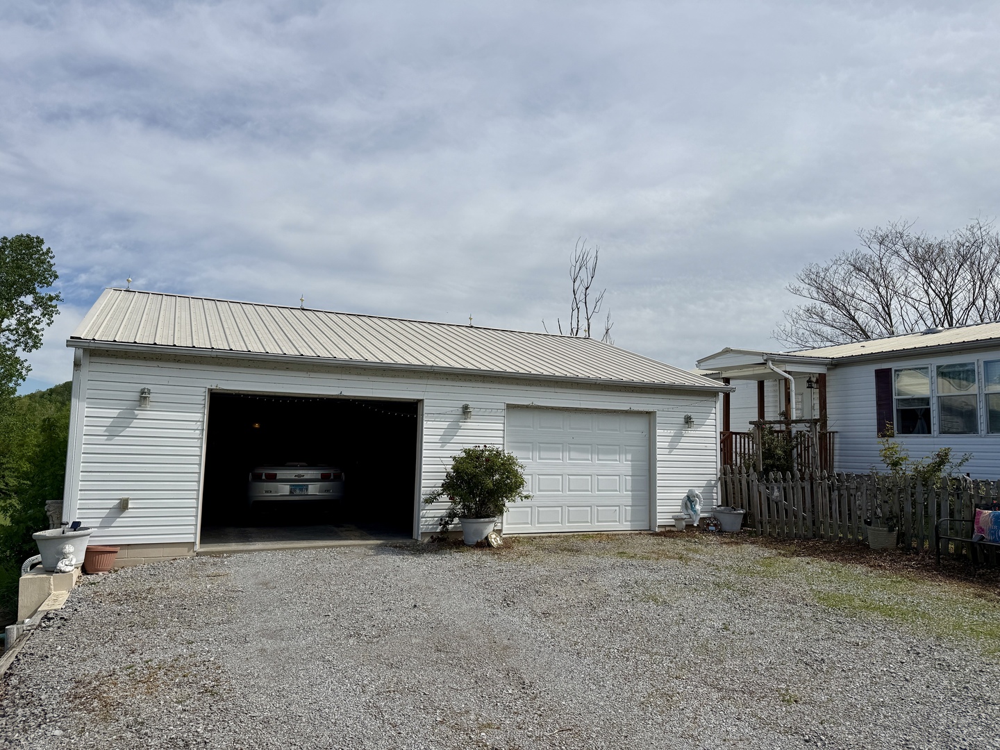 2025 Central Hill Road Grantsburg, IL 62943 - Photo 22 of 31 a front view of a house with a yard and garage