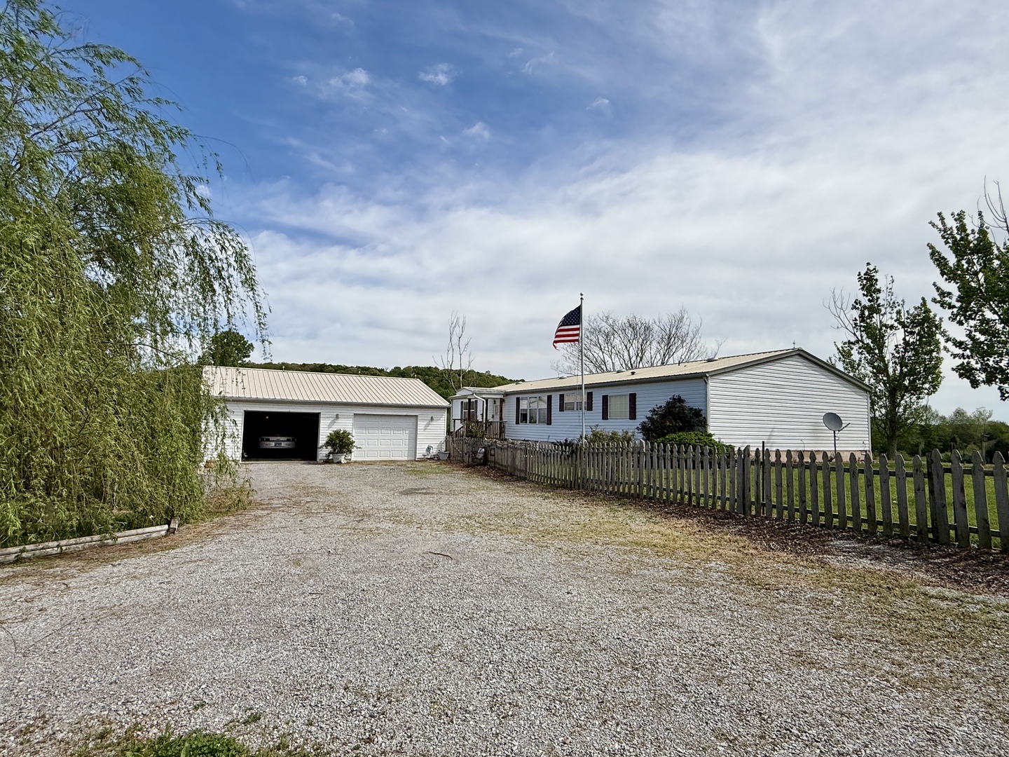 2025 Central Hill Road Grantsburg, IL 62943 - Photo 30 of 31 a view of a house with wooden fence