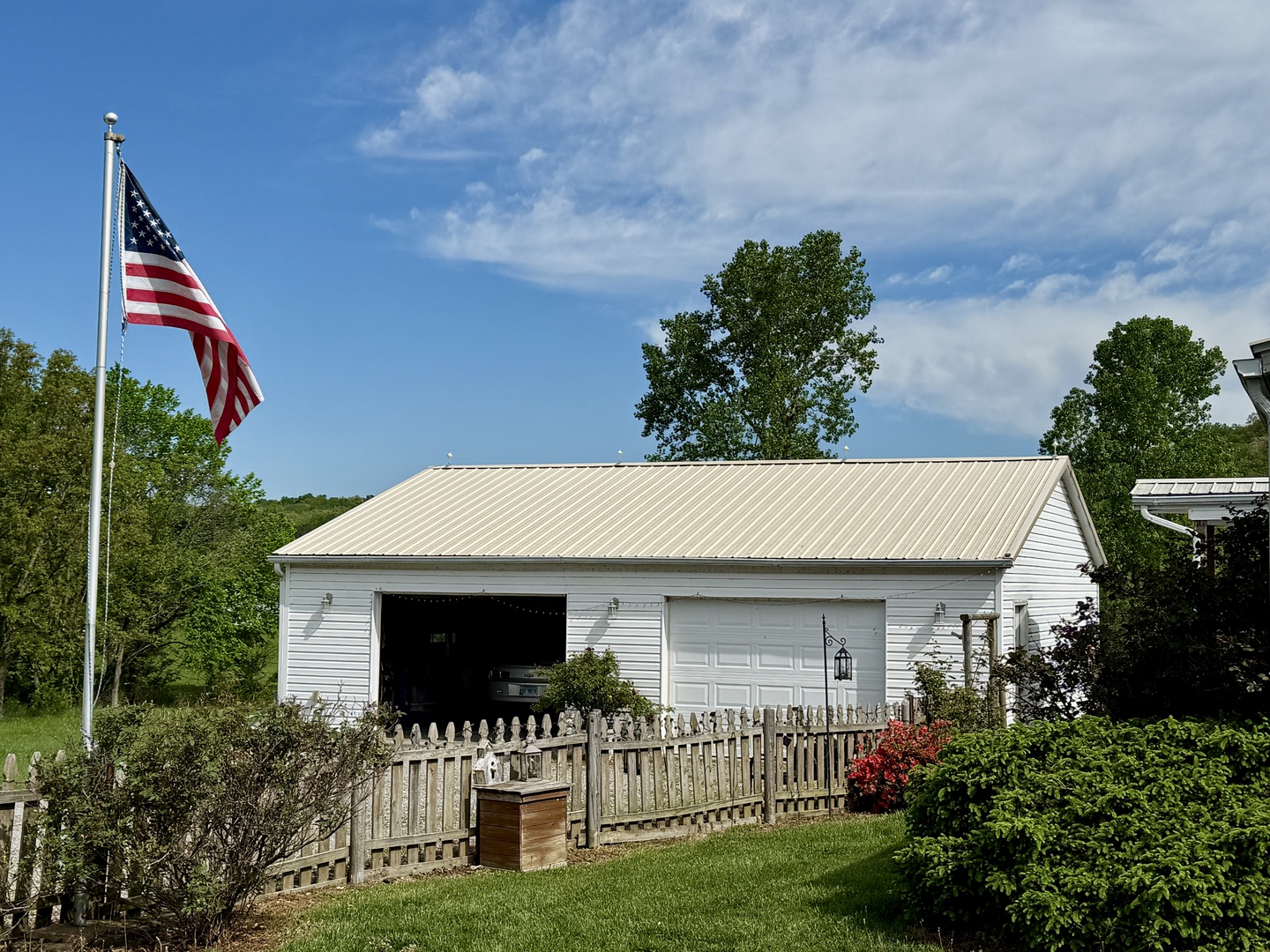 2025 Central Hill Road Grantsburg, IL 62943 - Photo 3 of 31 a front view of a house with a garden and plants