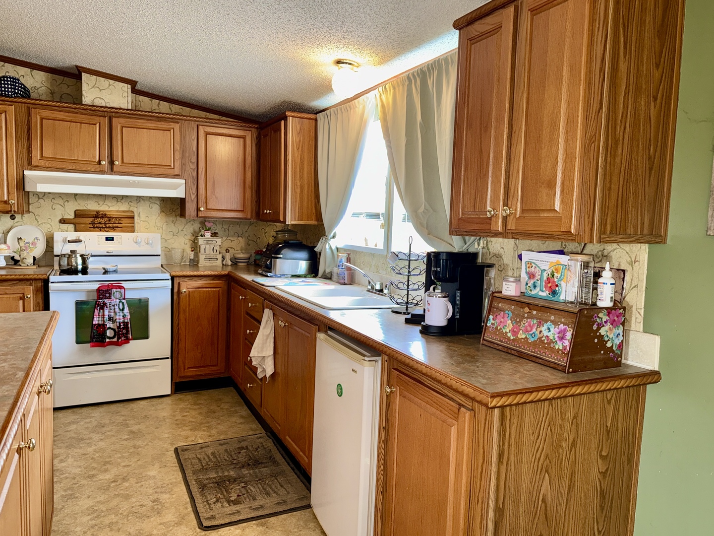 2025 Central Hill Road Grantsburg, IL 62943 - Photo 9 of 31 a kitchen with stainless steel appliances granite countertop a stove a sink dishwasher and cabinets with wooden floor