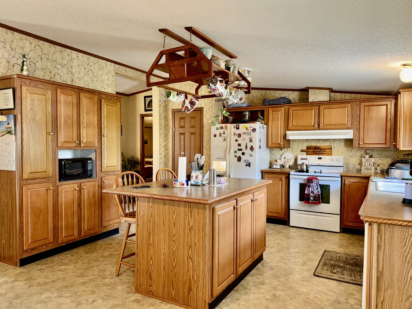 2025 Central Hill Road Grantsburg, IL 62943 - Photo 10 of 31 a kitchen with stainless steel appliances granite countertop a stove and a refrigerator