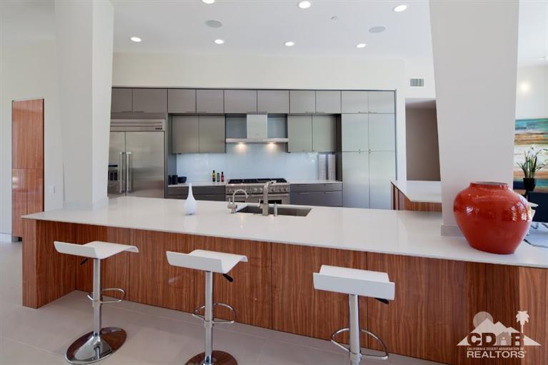 1 Mirada Circle Rancho Mirage, CA 92270 - Photo 12 of 29 a large kitchen with a table chairs refrigerator and cabinets
