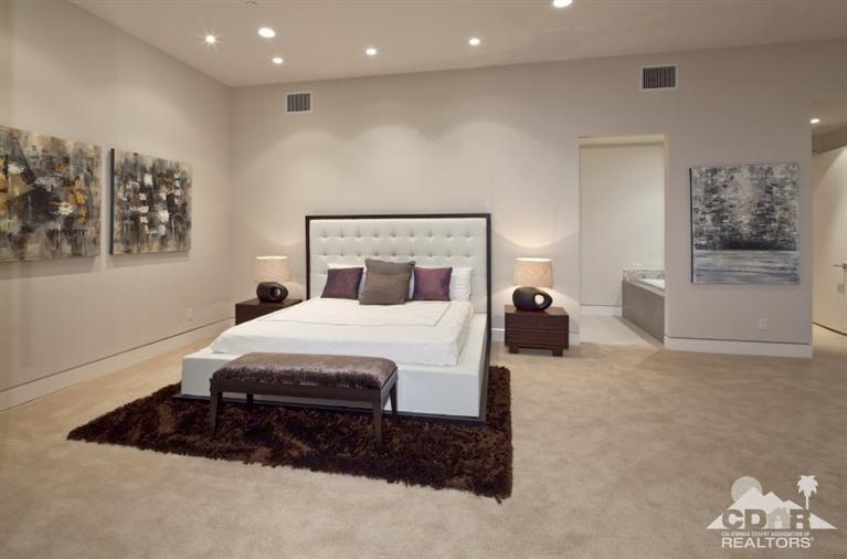 1 Mirada Circle Rancho Mirage, CA 92270 - Photo 17 of 29 a bed room with a bed and a painting