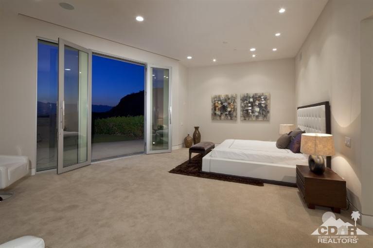 1 Mirada Circle Rancho Mirage, CA 92270 - Photo 18 of 29 a bedroom with a bed and a mirror