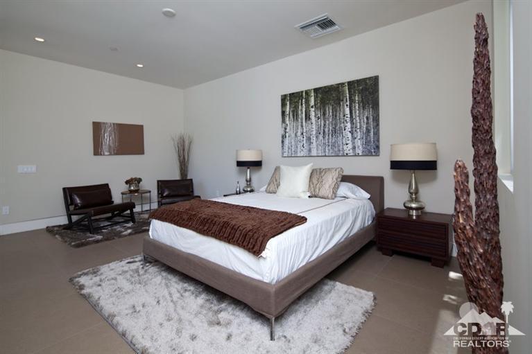 1 Mirada Circle Rancho Mirage, CA 92270 - Photo 19 of 29 a spacious bedroom with a bed and a desk