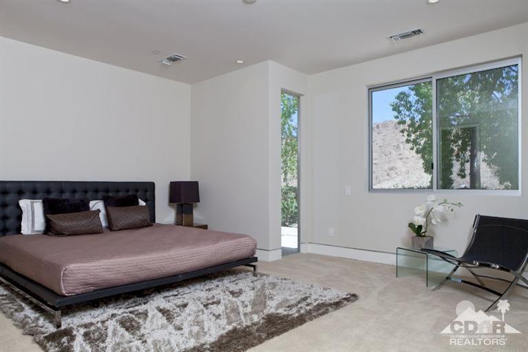 1 Mirada Circle Rancho Mirage, CA 92270 - Photo 20 of 29 a bedroom with furniture and a window