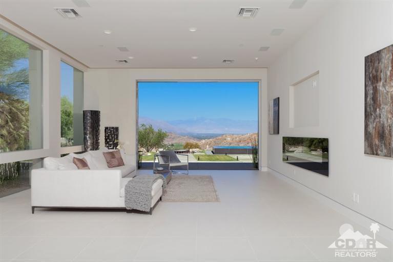 1 Mirada Circle Rancho Mirage, CA 92270 - Photo 5 of 29 a living room with furniture tv and a fireplace