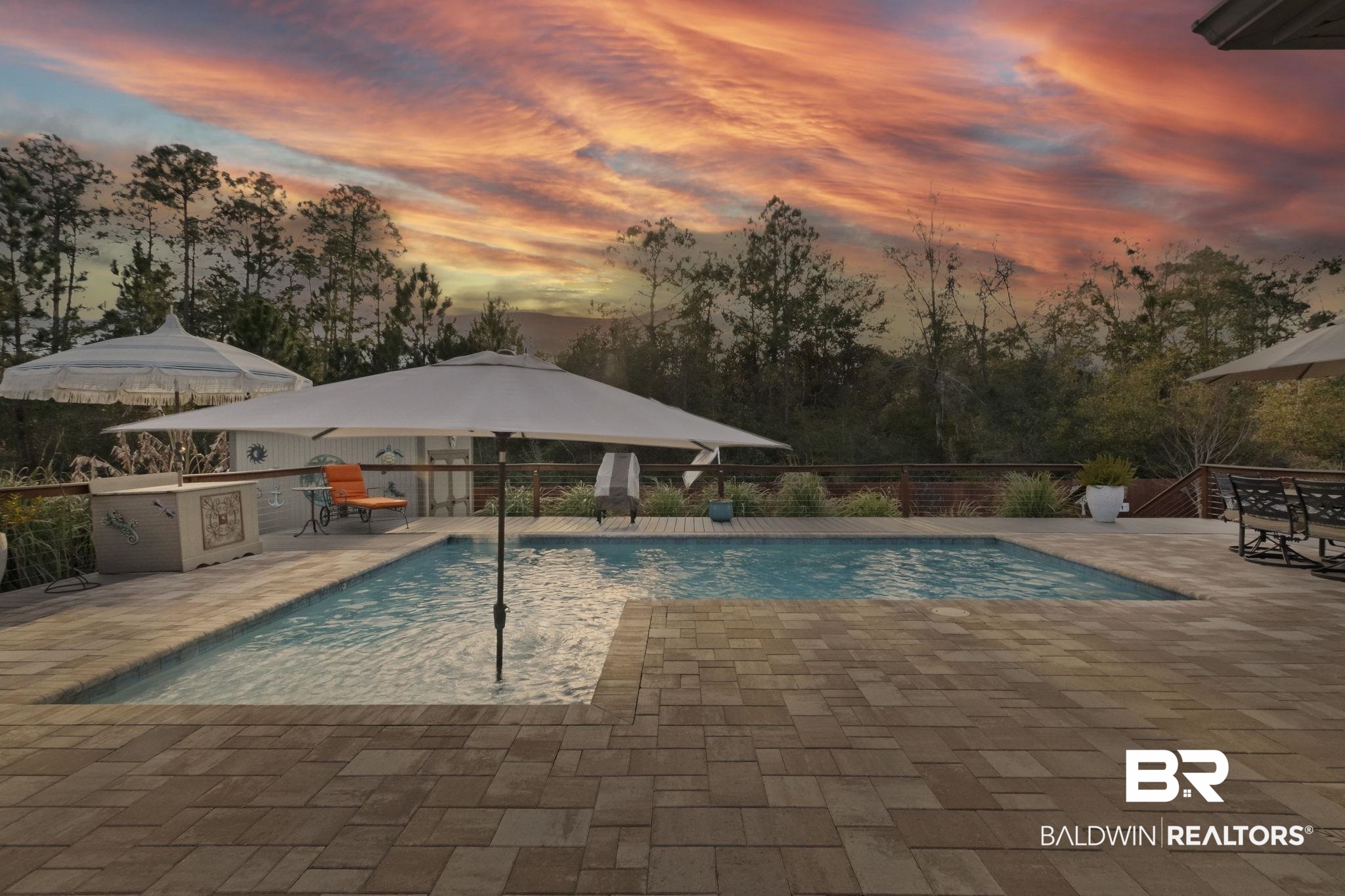 1737 Vivace Drive Foley, AL 36535 - Photo 70 of 73 Pool at dusk featuring an outdoor kitchen and a patio area
