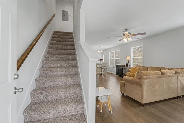 a dining room with furniture and window