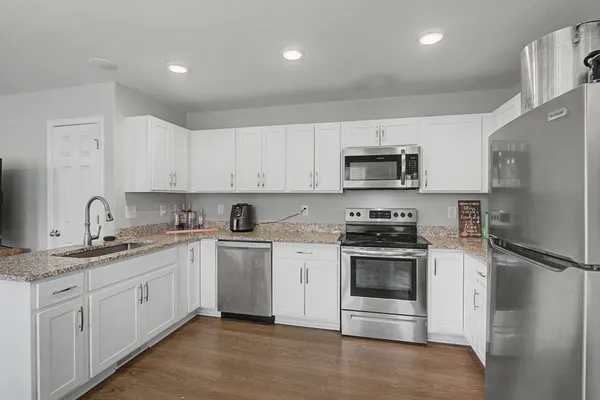 a bedroom with bed and tv