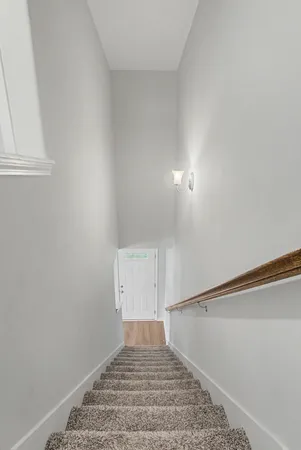 a view of a chairs and table in the balcony