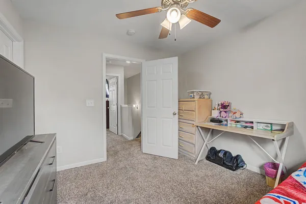 a view of dirt yard with a large tree