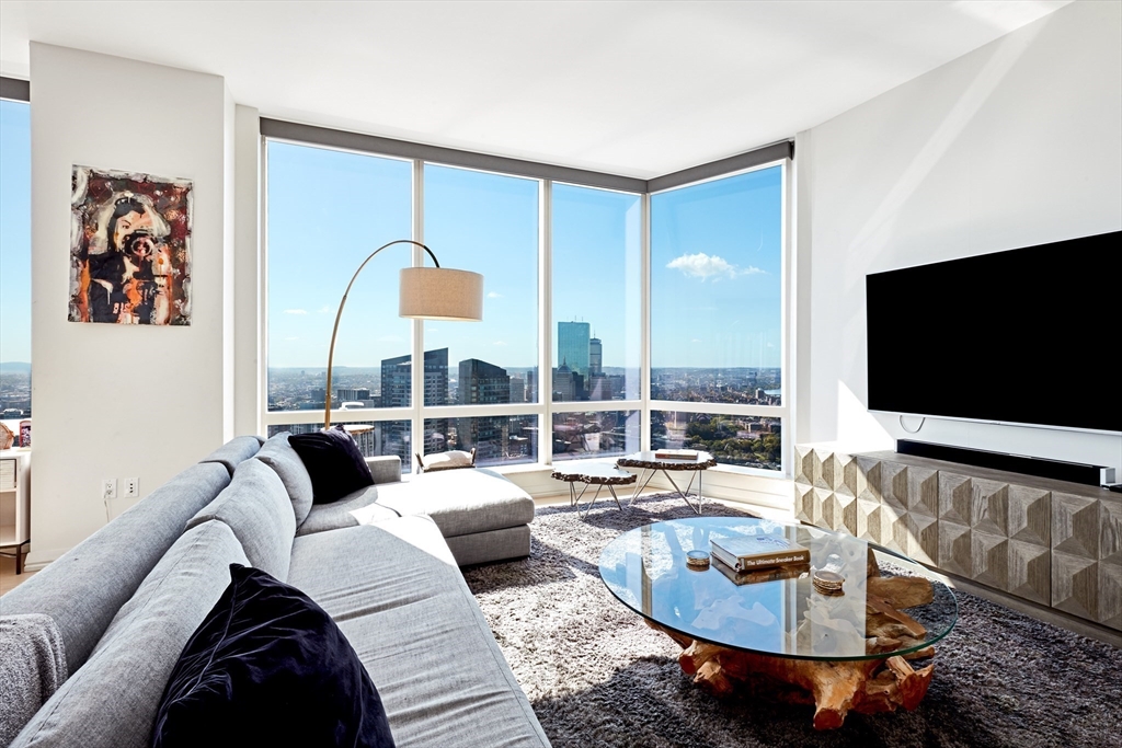 1 Franklin Street, Unit 4110 Boston, MA 02110 - Photo 3 of 22 a living room with furniture and a flat screen tv