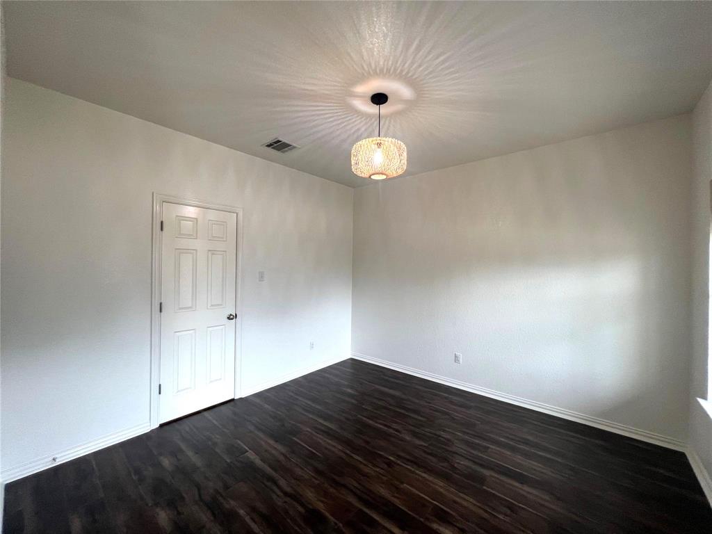 306 Howard Way Drive Aledo, TX 76008 - Photo 12 of 23 a view of empty room with wooden floor