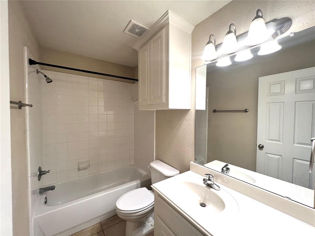 306 Howard Way Drive Aledo, TX 76008 - Photo 13 of 23 a bathroom with a sink a toilet and shower