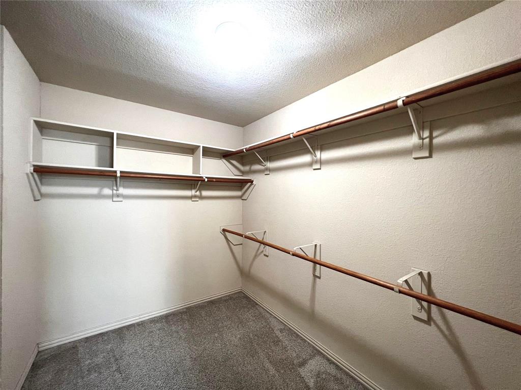 306 Howard Way Drive Aledo, TX 76008 - Photo 19 of 23 a view of a room with racks on the wall