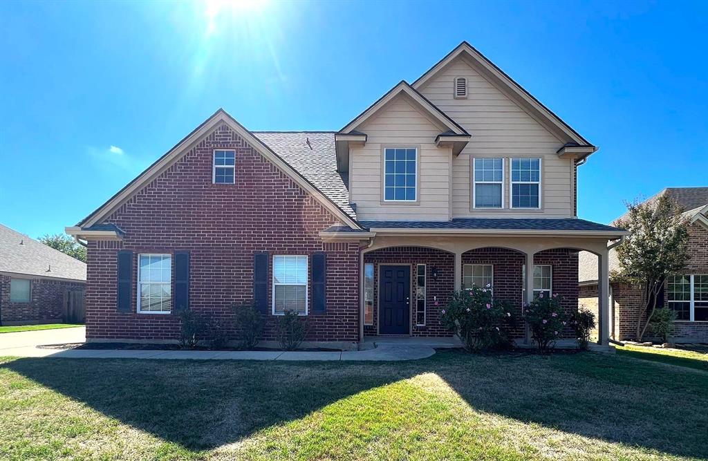 306 Howard Way Drive Aledo, TX 76008 - Photo 2 of 23 a front view of a house with a yard