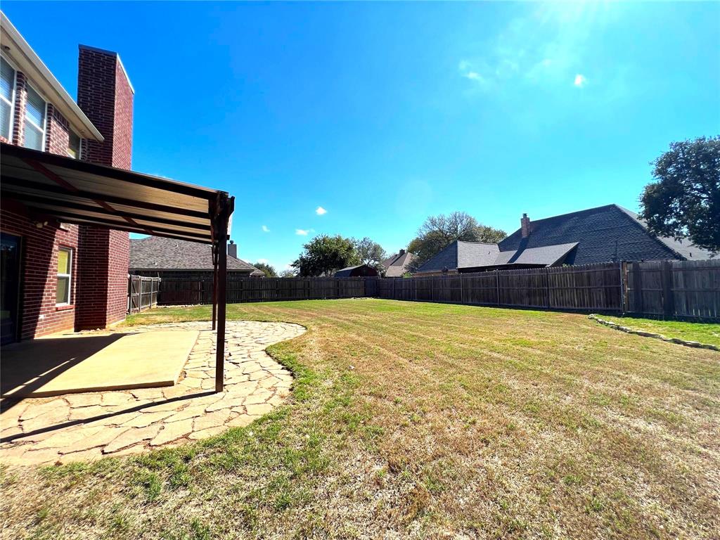 306 Howard Way Drive Aledo, TX 76008 - Photo 21 of 23 a view of an house with backyard and trees