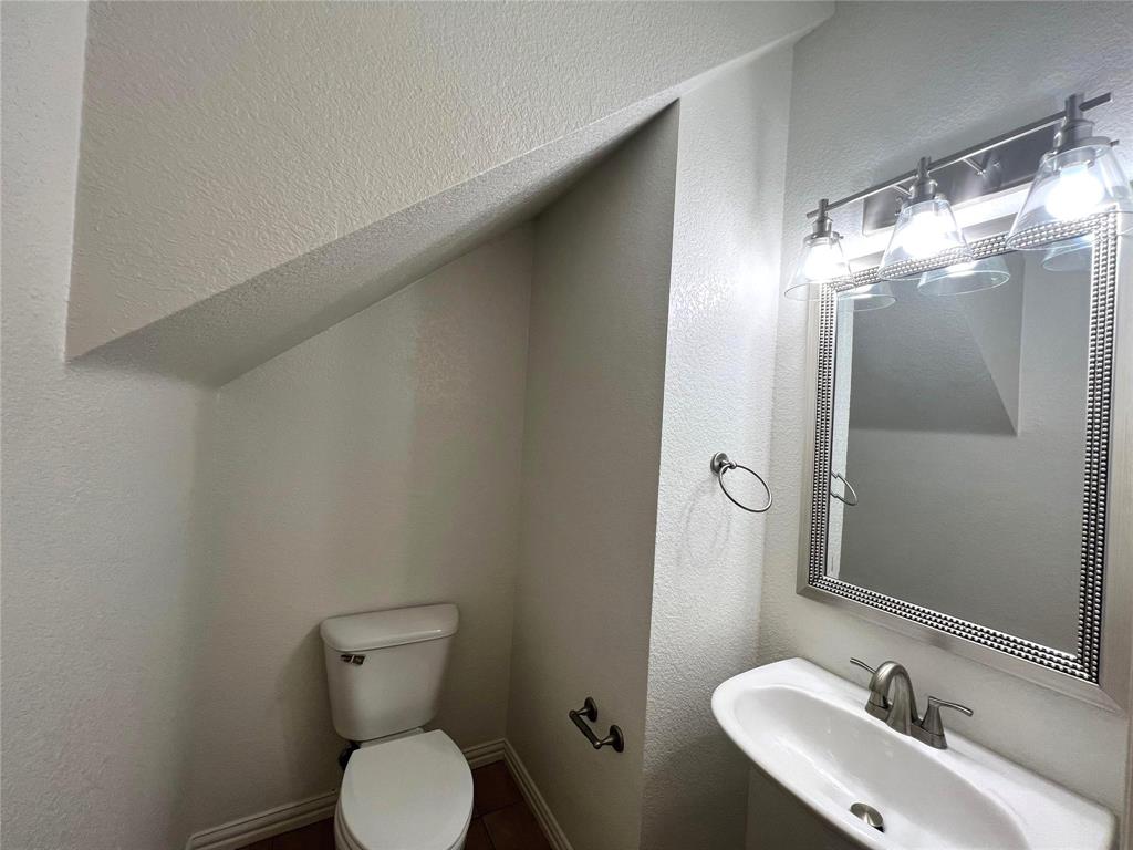 306 Howard Way Drive Aledo, TX 76008 - Photo 9 of 23 a bathroom with a sink toilet and shower