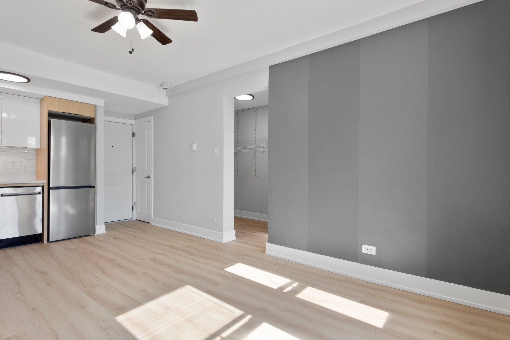 1634 West Howard Street, Unit 214 Chicago, IL 60626 - Photo 4 of 7 a view of an empty room with wooden floor